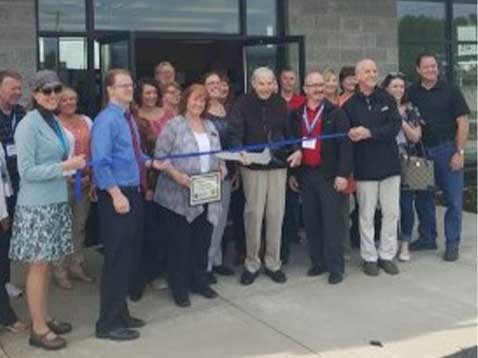 Dealership staff outside the storefront on opening day