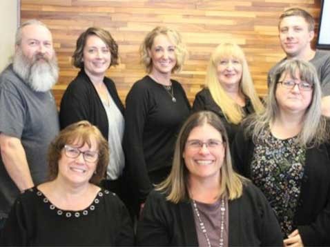 Dealership staff posing for a photo together